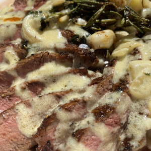 strip steak with garlic herb cheese sauce