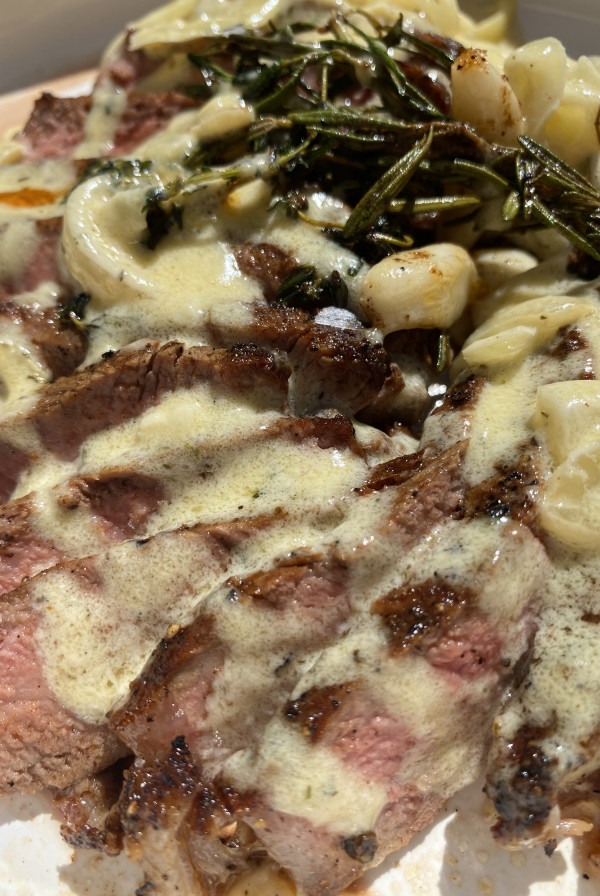 strip steak with garlic herb cheese sauce